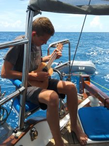playing the Ukelele on sailing trip to the dry tortugas
