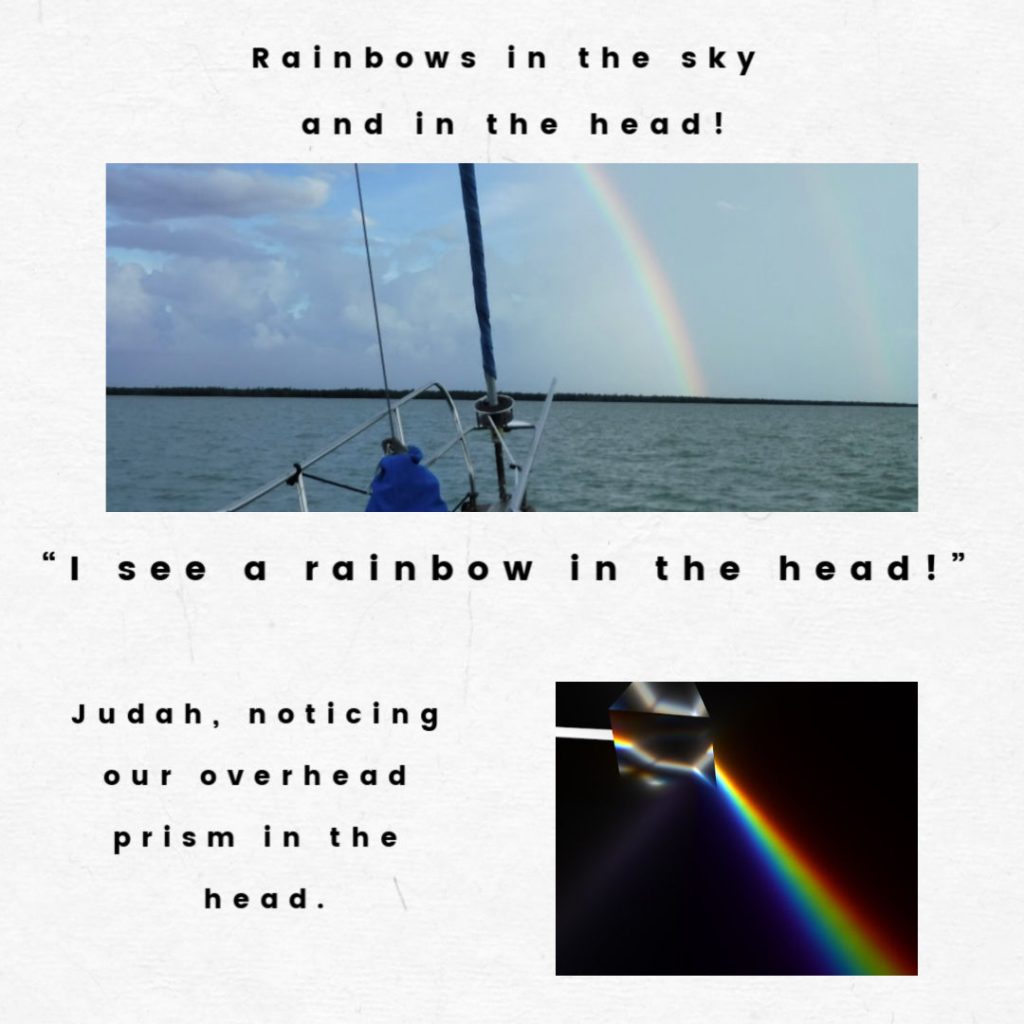 rainbow in sky and in sailboat head