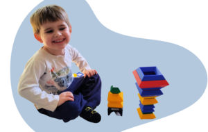 child building 3D designs with wedgits 