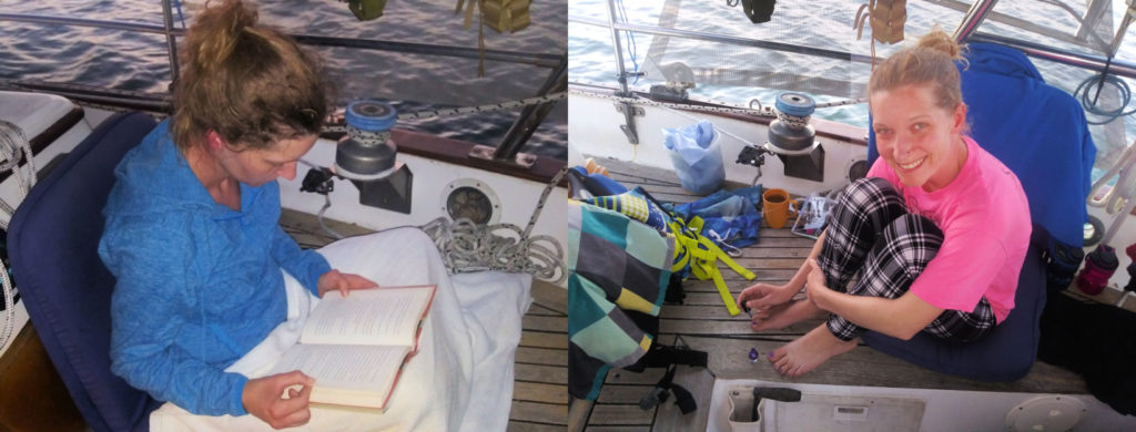 mom relaxing by painting toenails and reading a book in cockpit of sailboat 