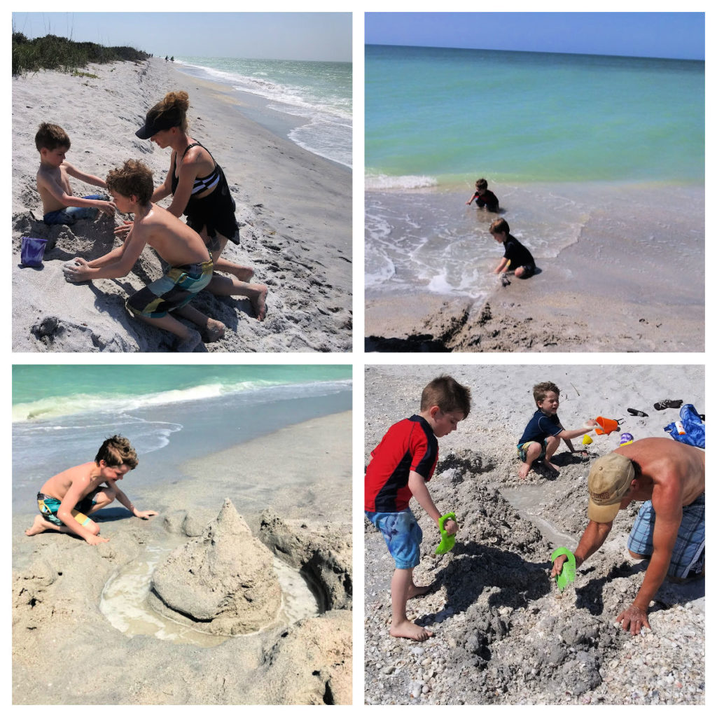 boys, mom, and grandpa playing in the sand making castles and trenches at the beach 