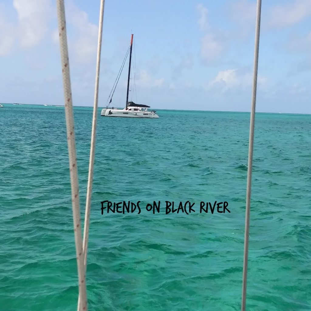 Sailboat Black River anchored nearby at West Bay, New Providence 