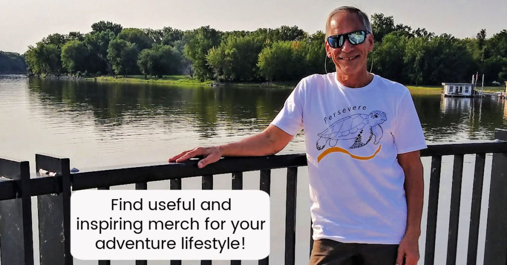 Tony wearing Tshirt with "persevere" and a sea turtle by the Mississippi river in Red Wing 
