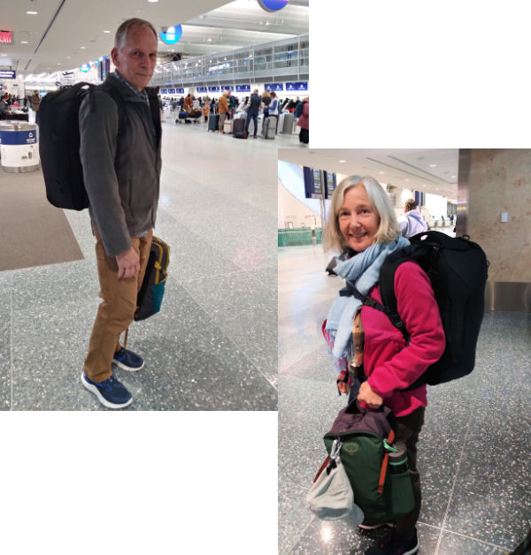 man and woman at airport with carry on backpacks on their backs
