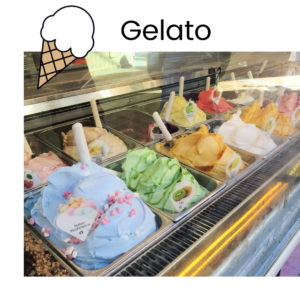 gelato flavors on display at an ice cream shop
