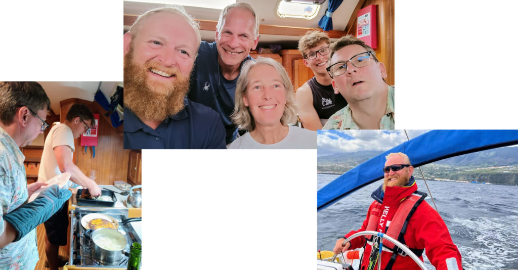 group pic of a happy crew on a sailing course, crew cooking in the galley, instructor at the helm
