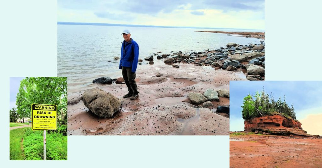 Tony standing on ocean floor Bay of Fundy, warning sign about the tidal range and risk of drowning, rock formation