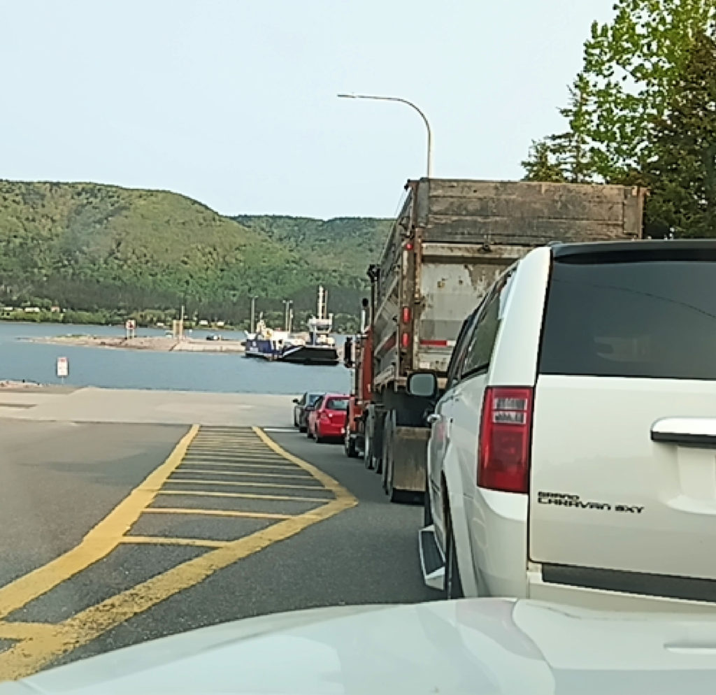 line of cars waiting for the Englishtown cable ferry on the way to Cape Breton's Cabot Trail 