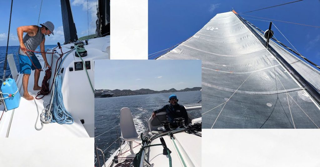 sail up with blue sky, man coiling lines on sailboat, man at helm of sailboat 