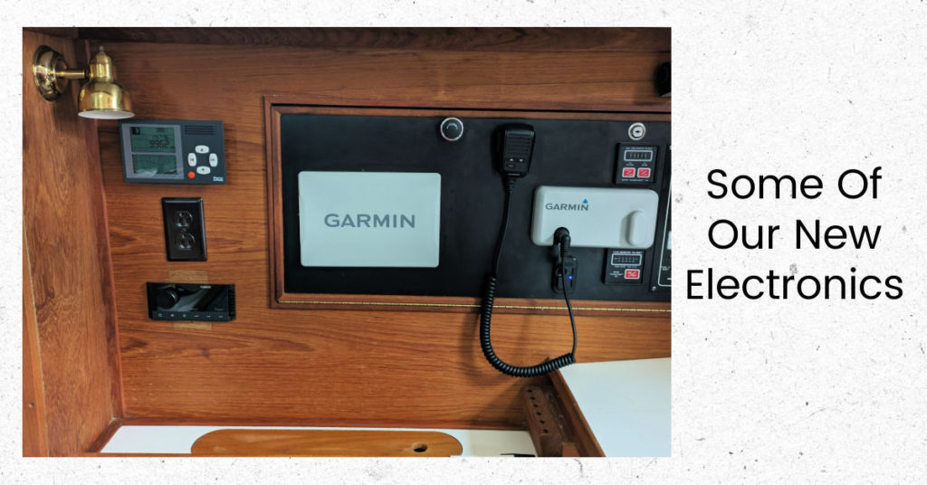 garmin electonrics, barometer, radio/stereo on a panel in the boat cabin 