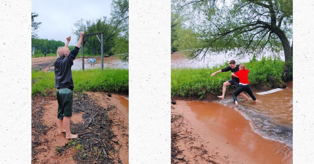 two young adults running out of water, one with arms up as winner of cold water contest 