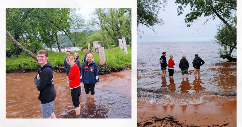 pics of people standing in lake superior near beach