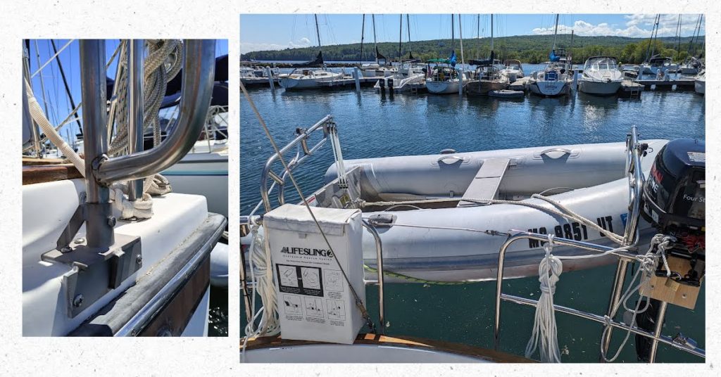 davit base close up picture and dinghy hanging from davits off stern of boat 