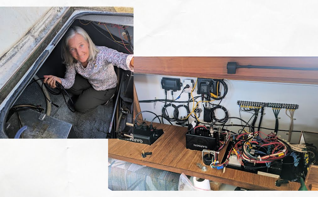 woman helping run wires in engine room of boat, electrical panel of boat with lots of wires