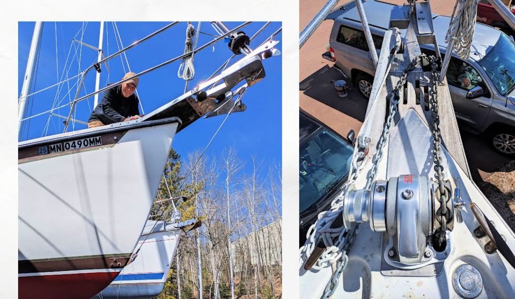 bow of sailboat with man working on installing windlass, new manual windlass with chain on it