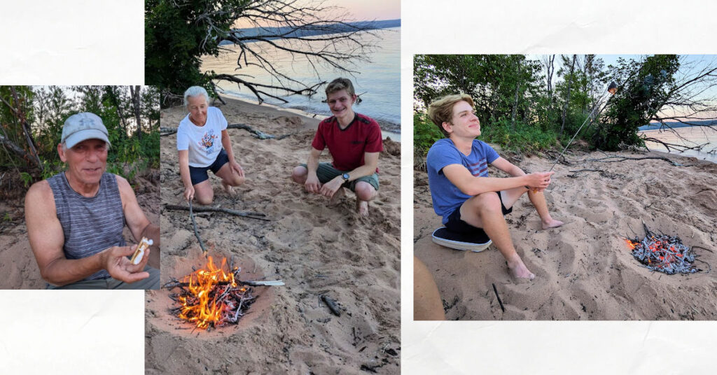 beach fire, teens and grandparents making smores 