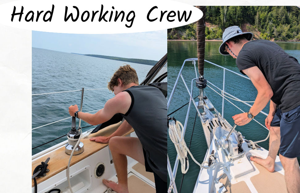 teen boys at sailboat winch and anchor windlass while on sailing trip on Lake superior 