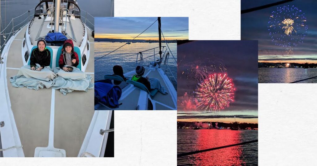 boys on bow of boat at sunset, fireworks over the water 