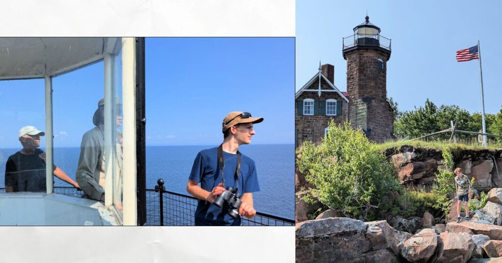 sand island lighhouse with men on the top looking out at teh lake and view of the lighthouse from the rocks at waters edge, flag flying 