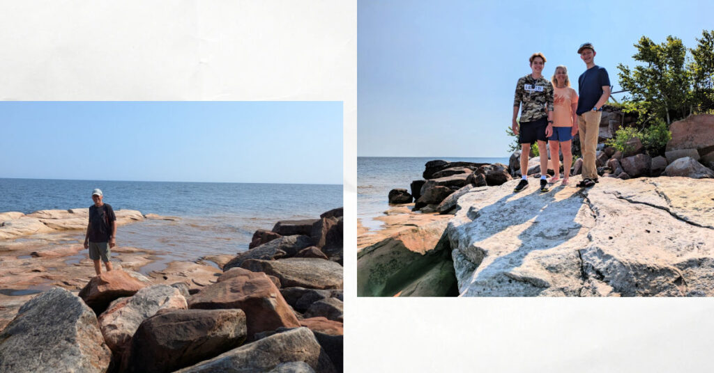 grandparents and teen grandchildren on big rocks on Sand Island, Lake Superior 