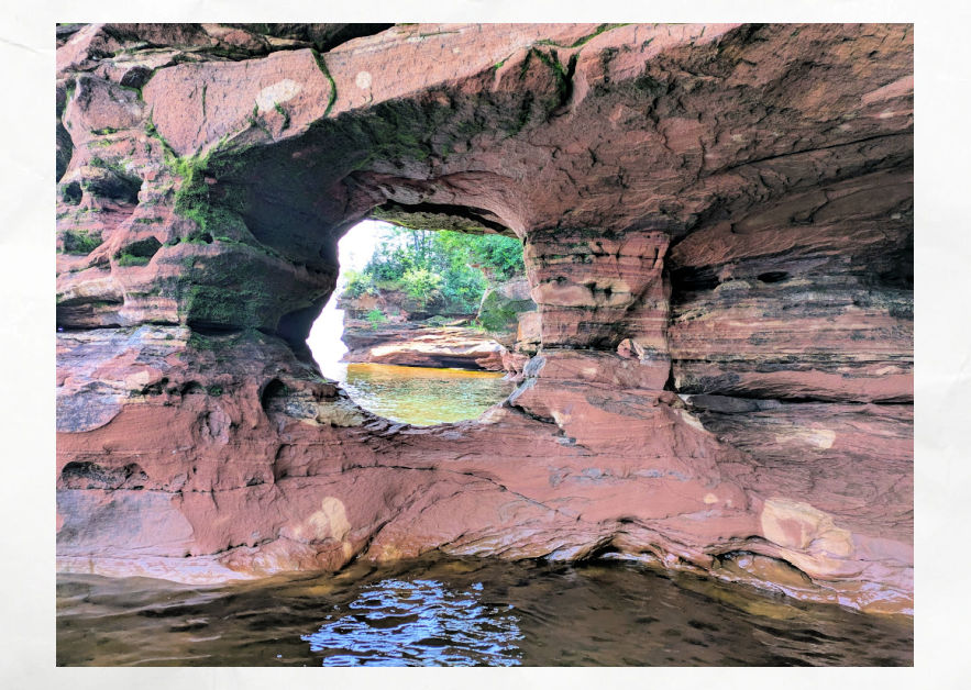 sea caves on sand island, a round hole that views the water and more shoreline of sea caves 