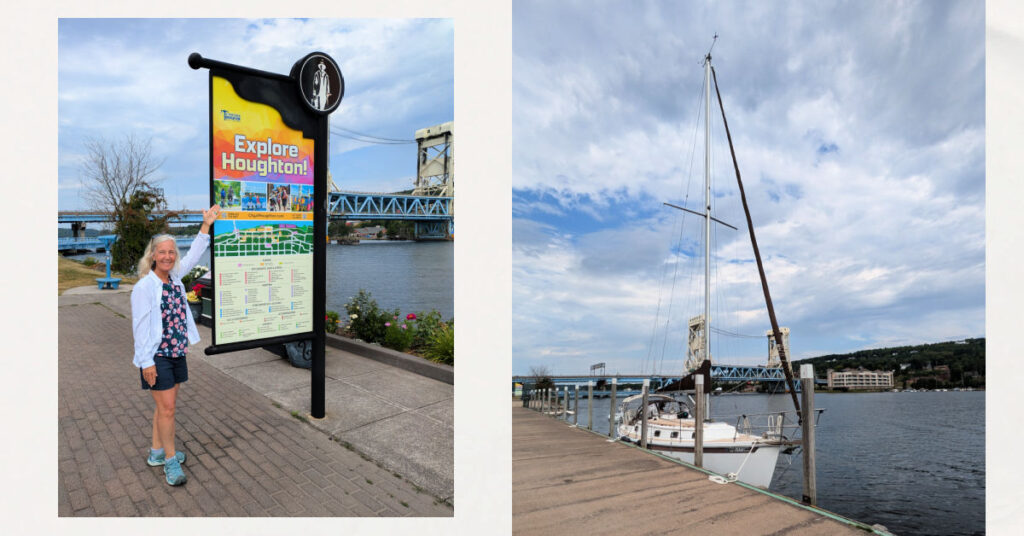 woman next to city of Houghton downtown sign, sailboat at houghton wall with no other boats nearby and bridge in background 