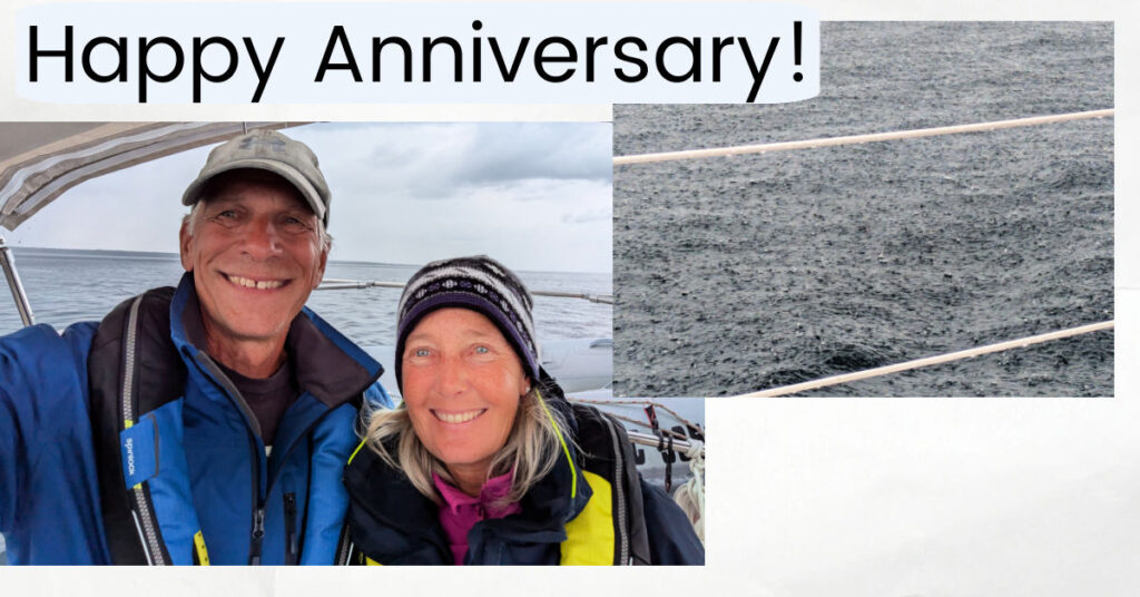 happy anniversary picture of couple on sailboat, hard raindrops on the water 