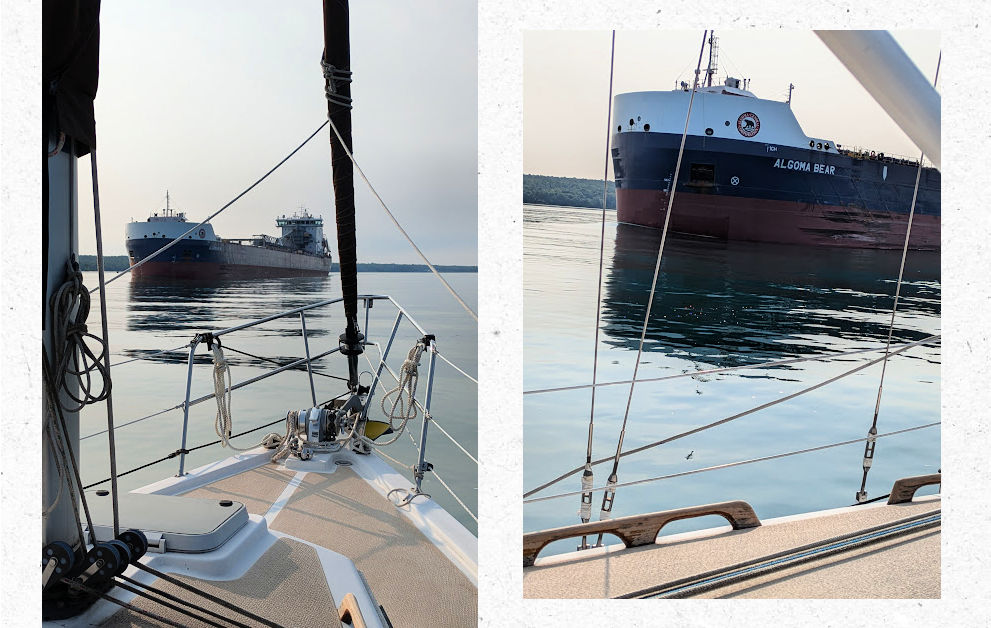 passing by freighters on a sailboat on st marys river
