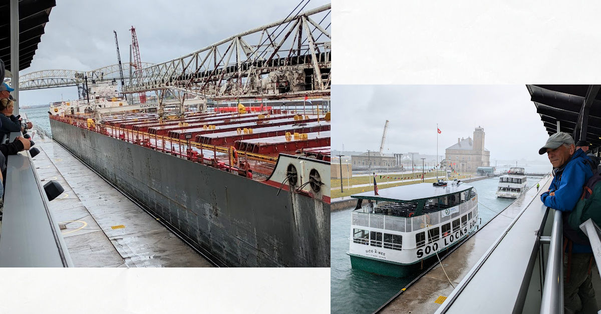 man looking from observation platform at tour boats and freighters going through the Soo locks 