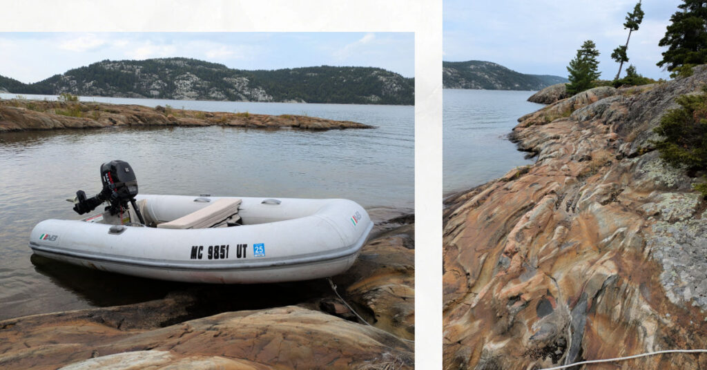 smooth and multi colored rocks along shore of baie fine in North Channel, dinghy pulled up on rock