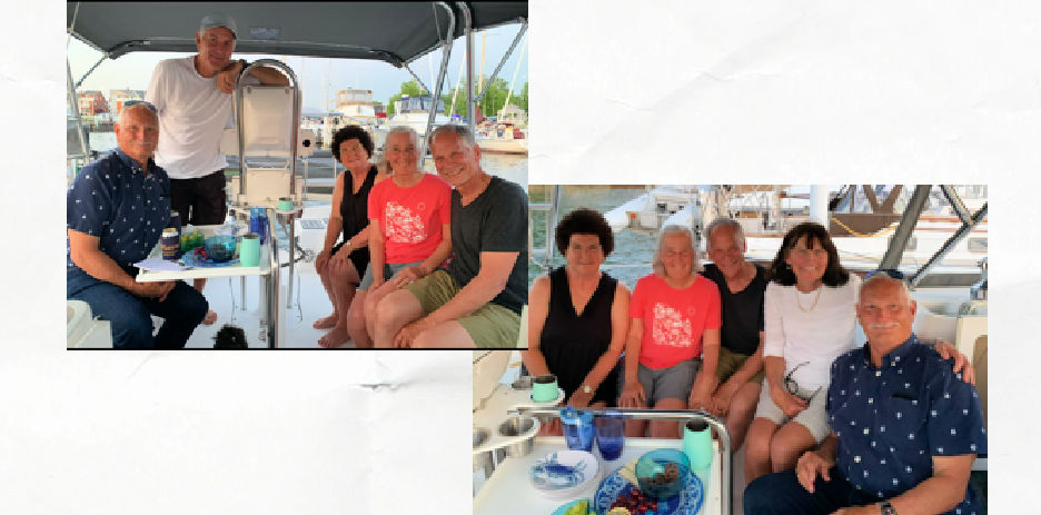3 couples visiting in sailboat cockpit 
