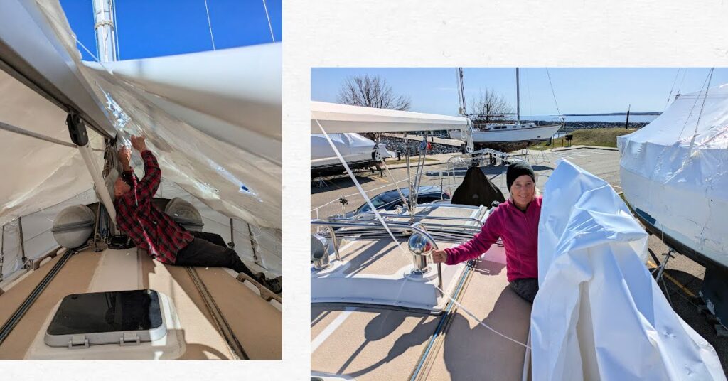 man and women taking shrink wrap off sailboat