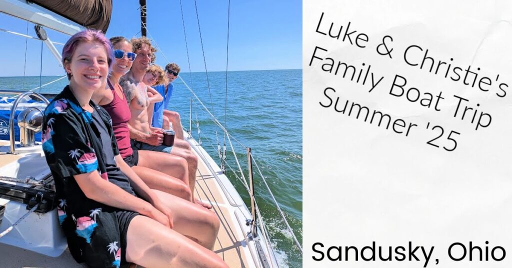 family on cabin top of sailboat while sailing on Lake Erie