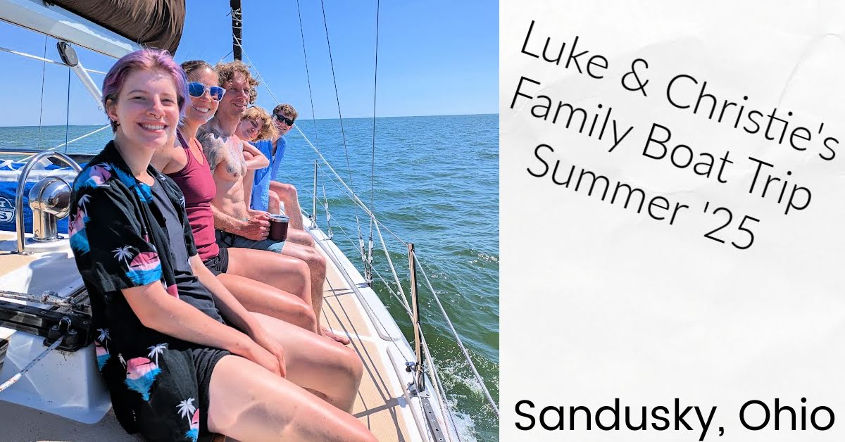 family on cabin top of sailboat while sailing on Lake Erie