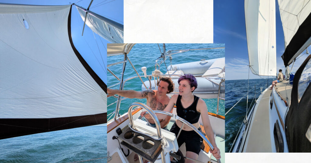 father and young adult child at the wheel of sailboat, sails up and water, deck of sailboat 