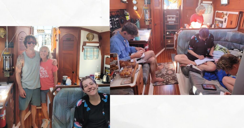 adults in sailboat cabin, reading, drawing, cooking, and smiling for picture 
