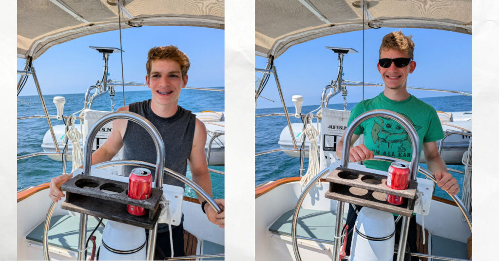 teen grandsons at wheel of sailboat sailing on Lake Erie 