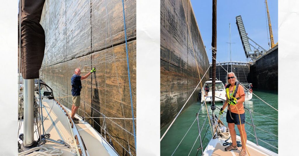 man and woman on deck of sailboat working lines in a lock