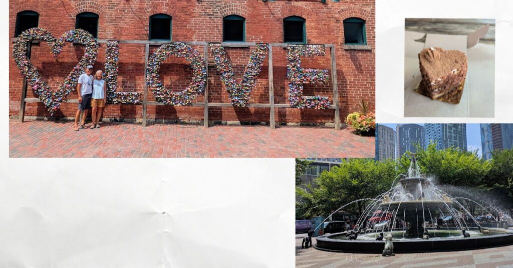 couple in front of big sign "love", tiramisu cake in shape of heart,  fountain with dog statues 
