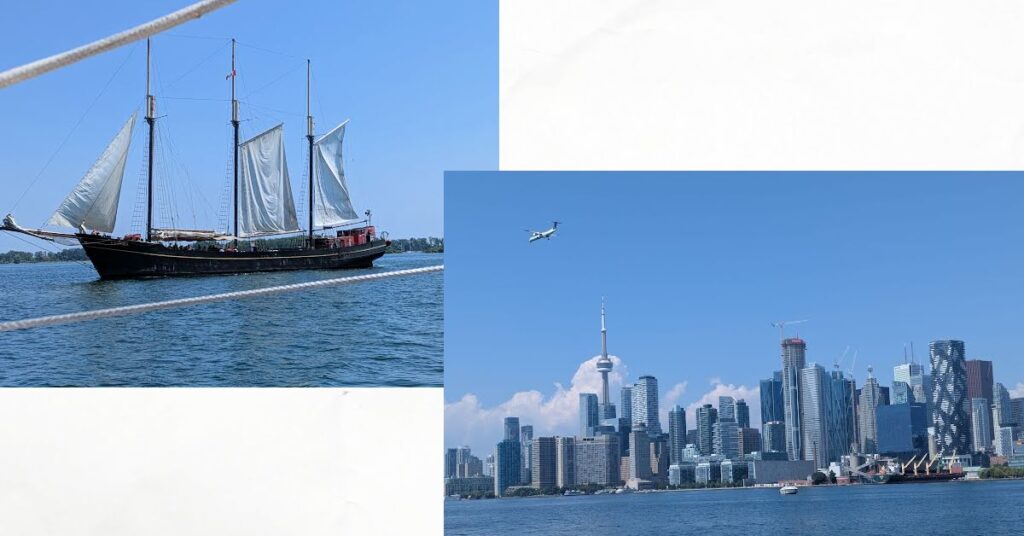 tall ship sailing by, city of Toronto skyline
