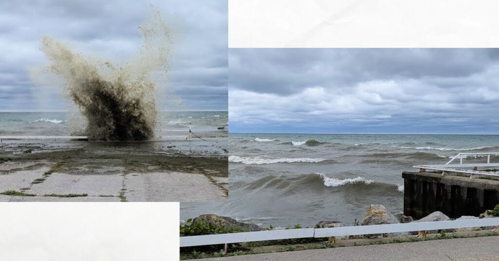 big waves with white caps near breakwater, muddy wave crashing over breakwater