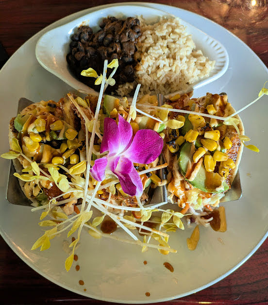 fancy fish tacos with beans and rice 
