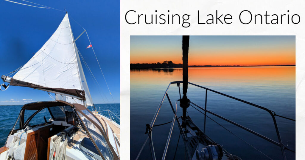 sailboat under sail and bow of boat at anchor with orange sunset